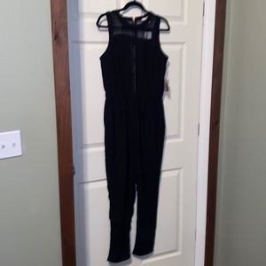 Black sleeveless jumpsuit with sheer
